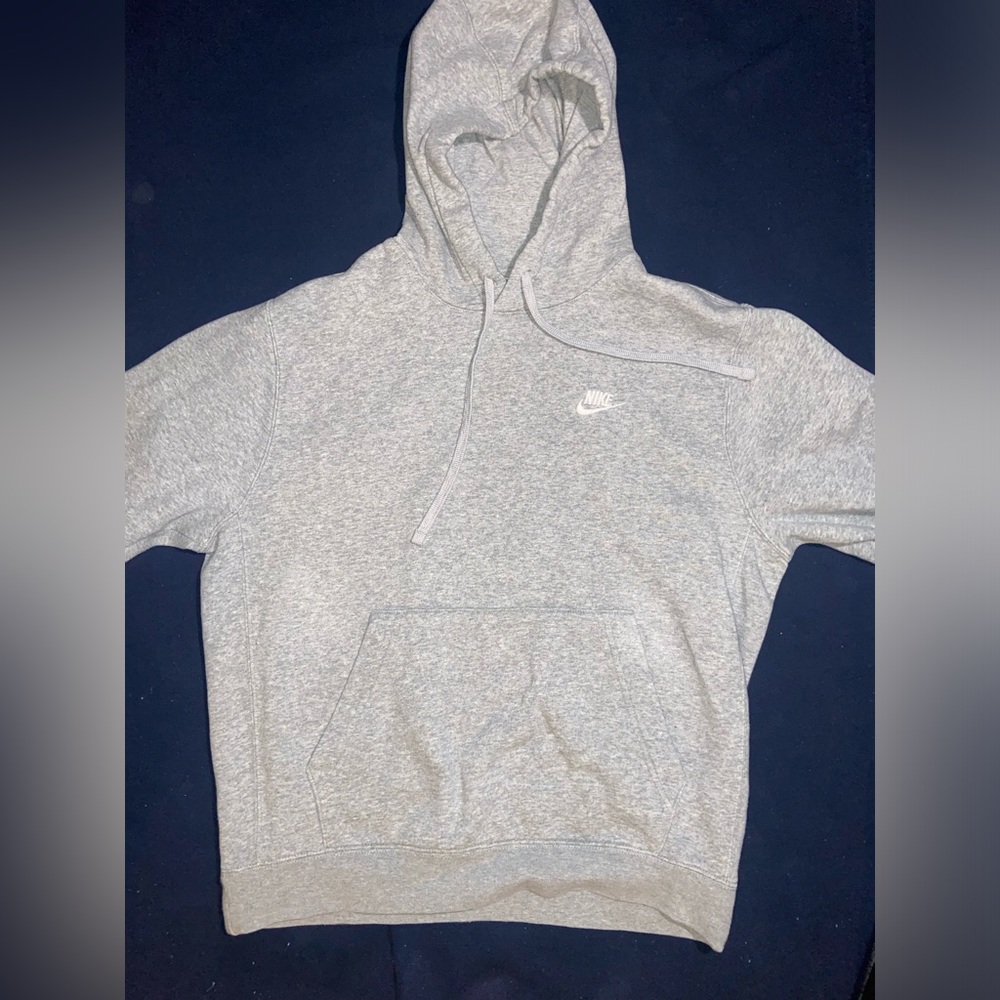 Grey Nike hoodie.